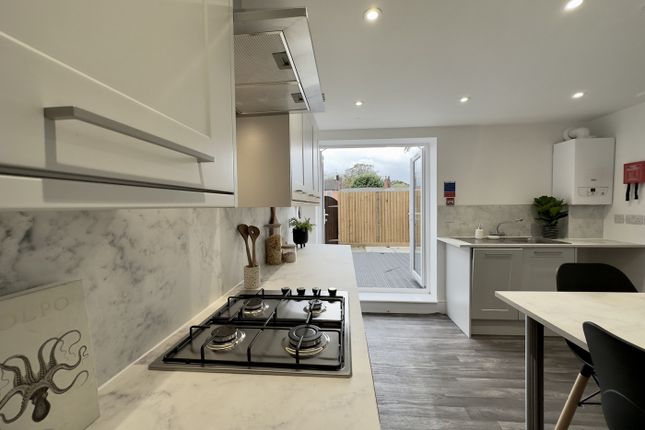 A Bright And Modern Kitchen With A Stylish Design,...