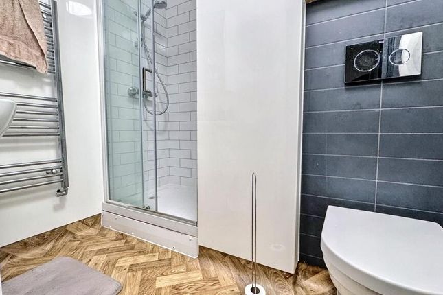 Modern Bathroom With A Walk-In Shower, Wall-Mounte...