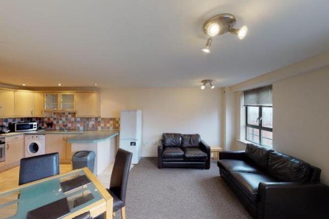 A Cozy And Well-Maintained Living Room Featuring A...