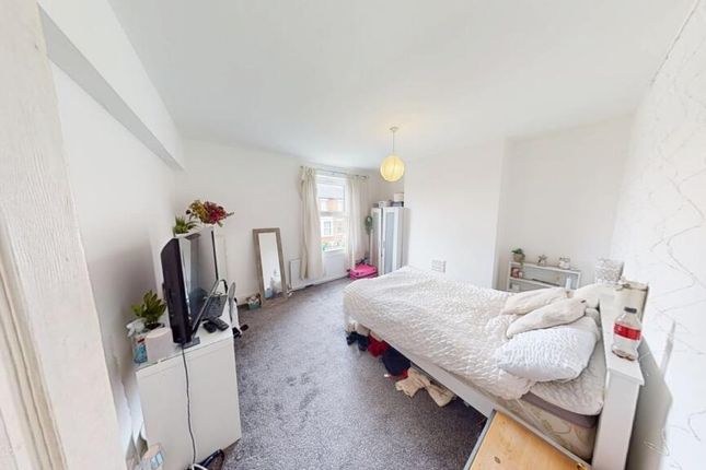 A Bright And Airy Double Bedroom Featuring A Comfo...
