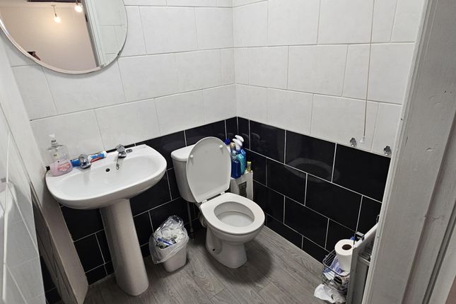 A Clean And Spacious Bathroom Featuring A Large Ba...