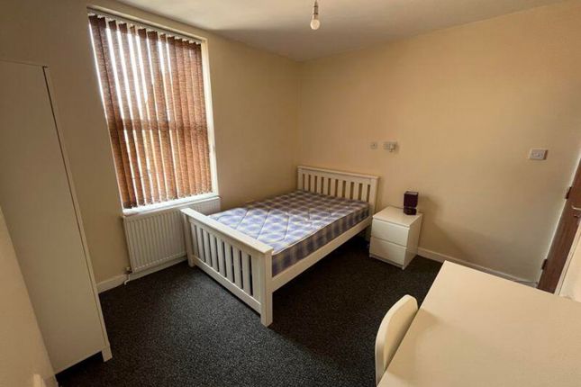 A Bright And Inviting Double Bedroom Featuring A c...