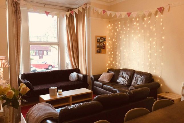 Warm, Inviting Living Room With Comfortable Leathe...