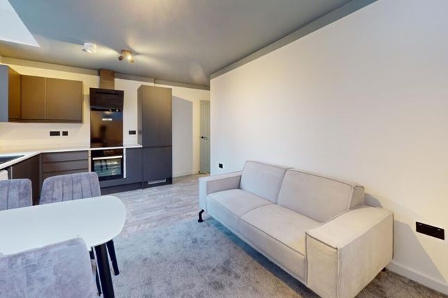 A Spacious And Modern Living Room Featuring Stylis...