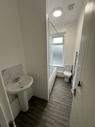 Bright And Clean Bathroom Featuring A Modern Bath ...