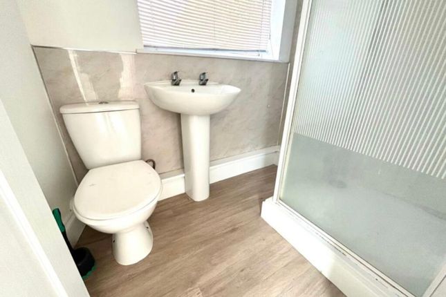 A Modern And Clean Bathroom Featuring A Refreshing...
