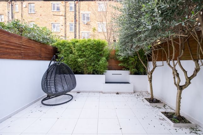 Terraced house to rent in Addison Gardens, London