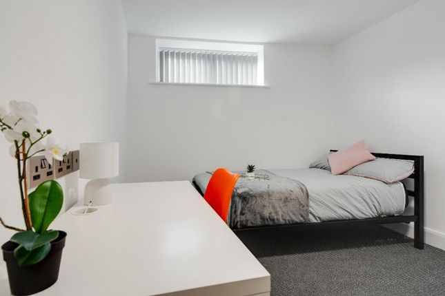 A Cozy Double Bedroom Featuring A Comfortable Bed ...