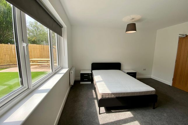 A Spacious And Bright Double Bedroom Featuring Lar...