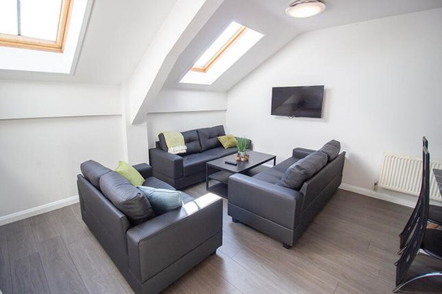 A Bright And Spacious Living Room Featuring Contem...
