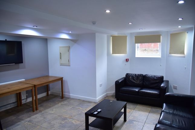 A Well-Lit, Modern Living Room Featuring A Comfort...