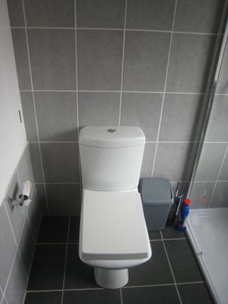A Modern And Clean Single Toilet Featuring Sleek T...