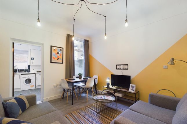 A Stylish And Spacious Modern Living Room With Amp...