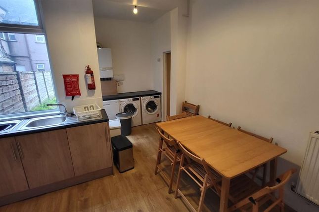 A Compact And Functional Kitchen Space Featuring W...