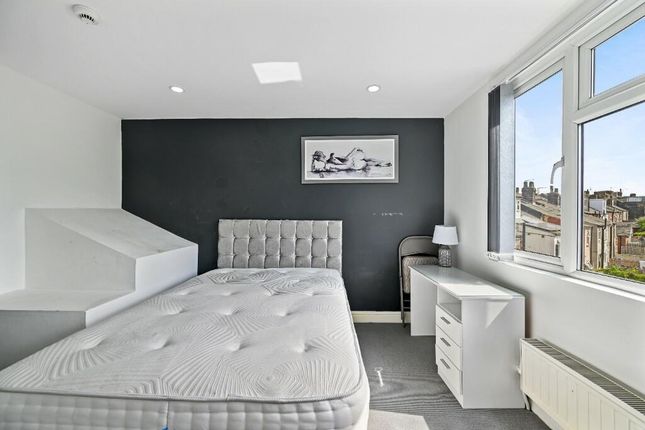 Bright And Modern Master Bedroom Featuring A Comfo...