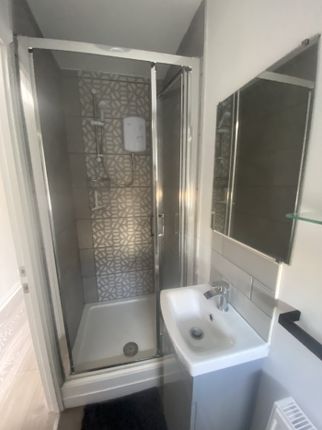 A Modern And Clean Bathroom Featuring A Stylish Sh...