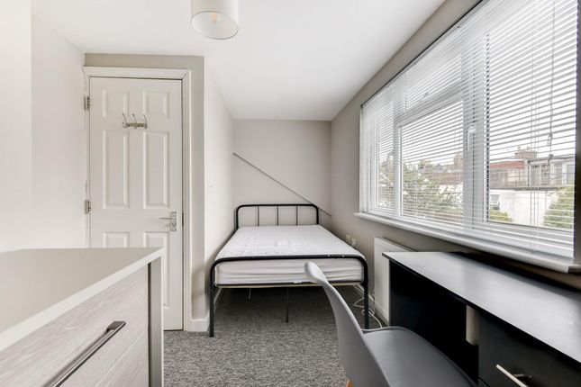 A Bright And Tidy Single Bedroom Featuring A Bed, ...