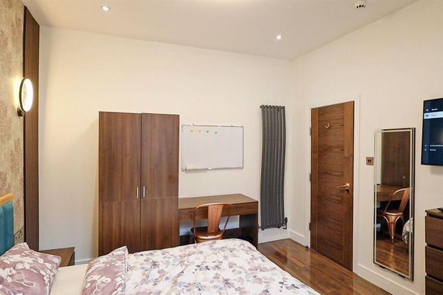 A Bright And Inviting Master Bedroom Featuring A c...