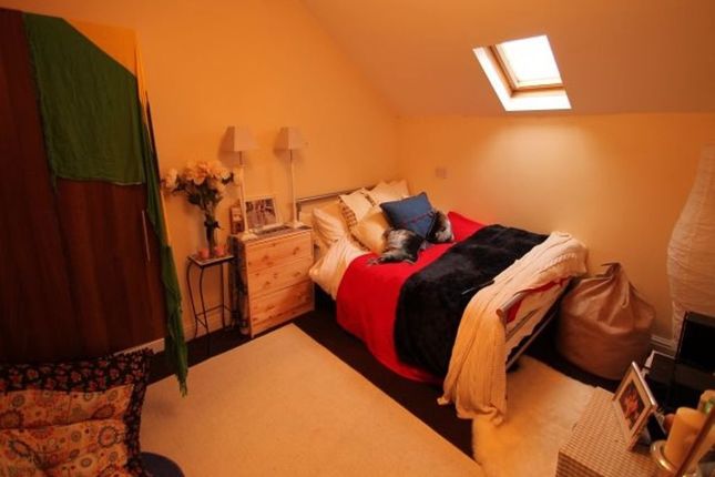 A Spacious Master Bedroom Featuring A Large Double...