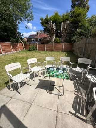 A Spacious Garden Area Featuring A Well-Maintained...