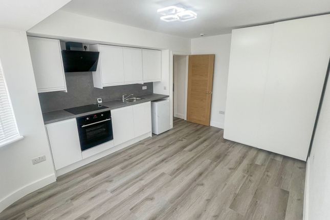 Bright And Modern Kitchen With Sleek White Cabinet...