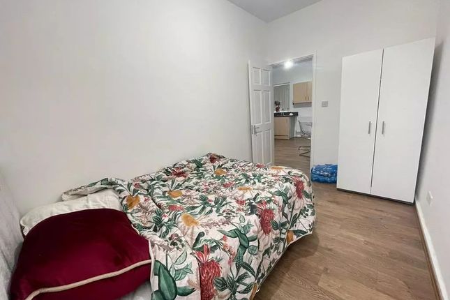 A Neat And Simple Single Bedroom Featuring A Comfo...