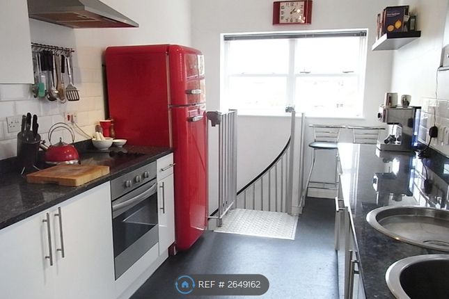 Large Kitchen With Spiral Stairs To Utility