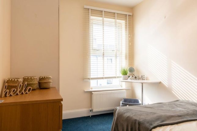 A Bright And Inviting Double Bedroom Featuring Lar...