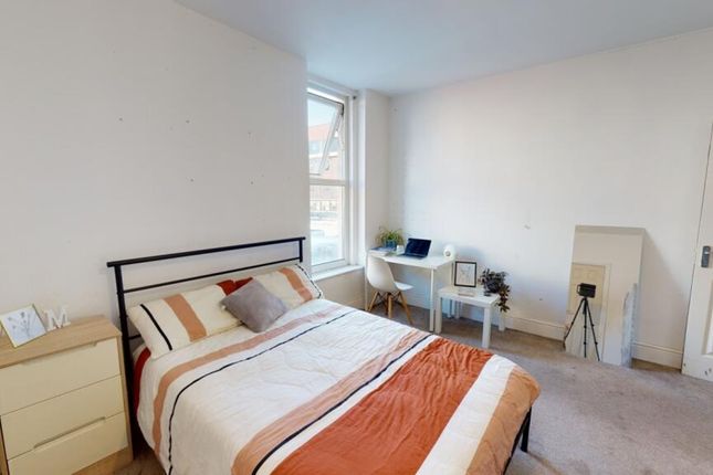 A Bright And Inviting Double Bedroom Featuring A c...