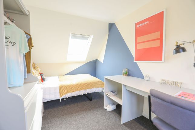 This Inviting Double Bedroom Features A Cozy Atmos...