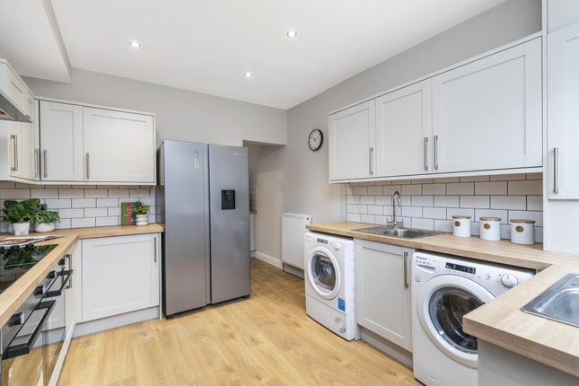 A Modern, Well-Maintained Kitchen Featuring White ...