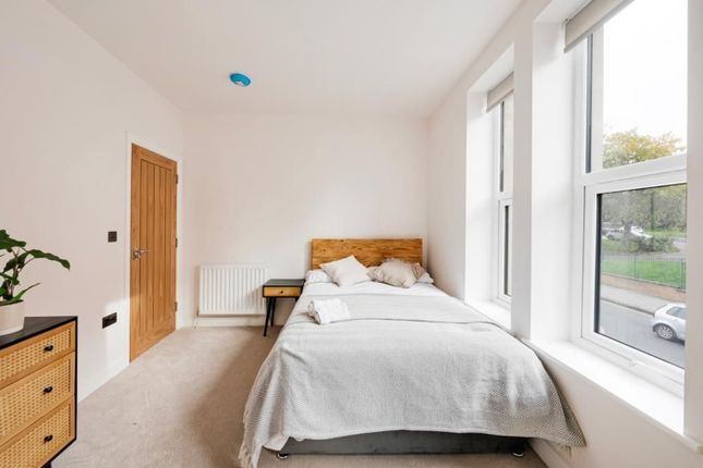 A Bright And Tidy Double Bedroom Featuring Large W...