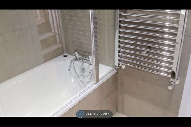 Modern Tiled Bath With Glass Screen