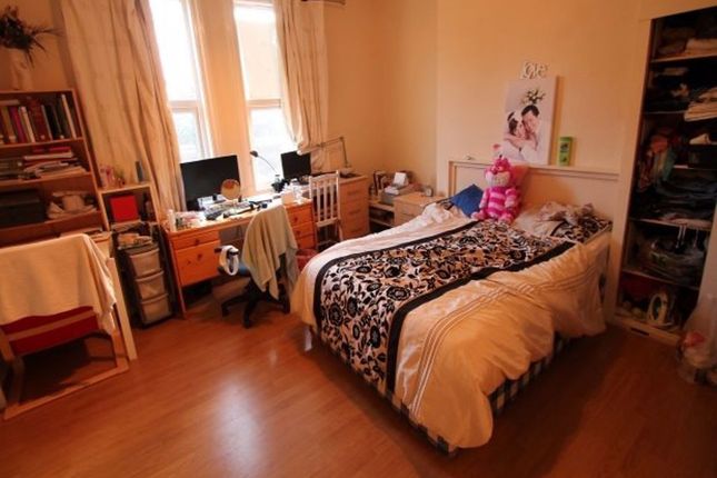 A Cozy Student Bedroom With A Single Bed, A Window...