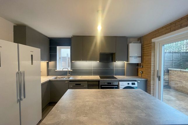 This Modern Kitchen Features A Spacious Layout Wit...