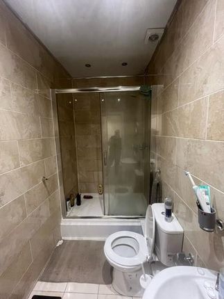 A Modern Bathroom Featuring A Spacious Shower Encl...