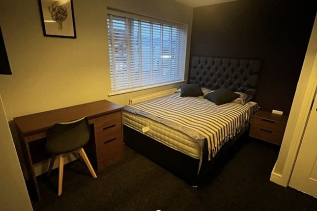 Cozy Double Bedroom Featuring A Comfortable Bed Wi...