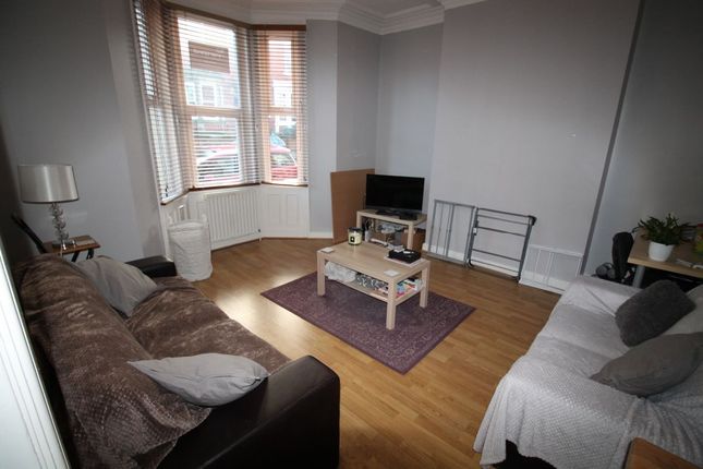 A Well-Lit, Comfortably Arranged Living Room Featu...