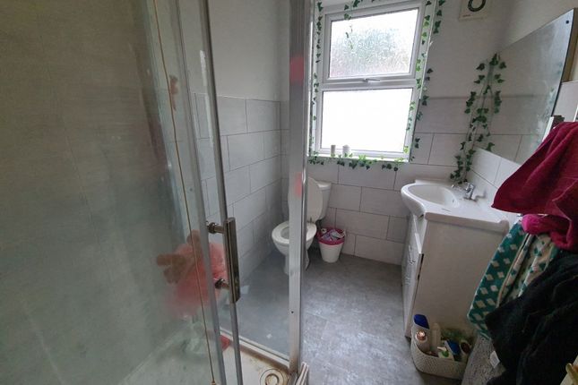 A Clean And Functional Bathroom Featuring A Shower...
