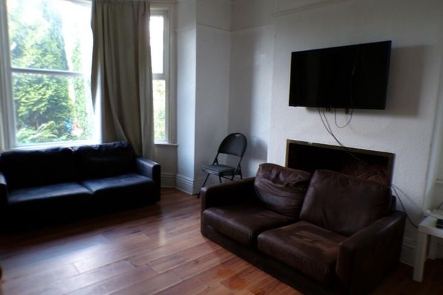 Bright And Inviting Living Room Featuring Comforta...