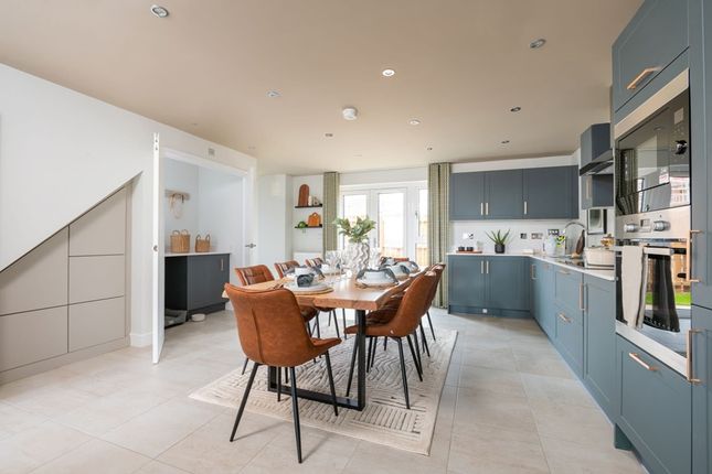 A Spacious Kitchen Area With French Doors Leading To The Rear Garden