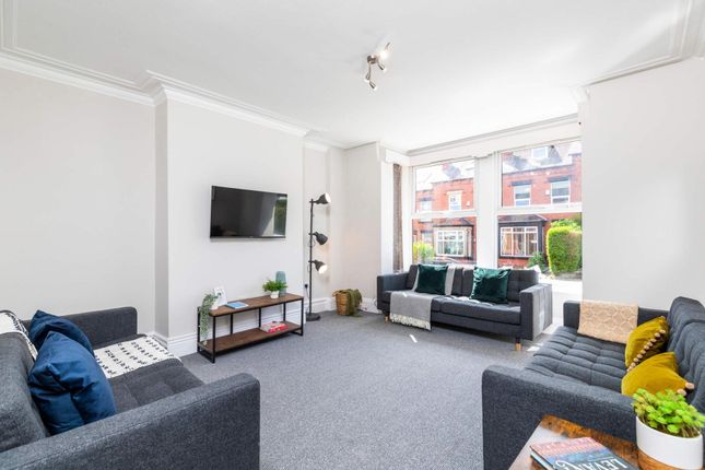 Bright, Contemporary Living Room With Multiple Sof...