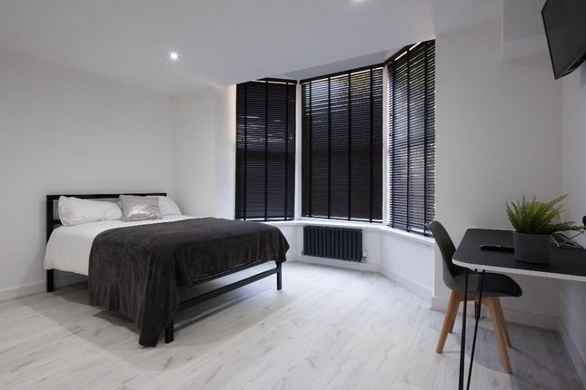 Bright And Modern Master Bedroom Featuring Large W...