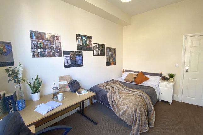 Bright, Neatly Arranged Bedroom With A Comfortable...