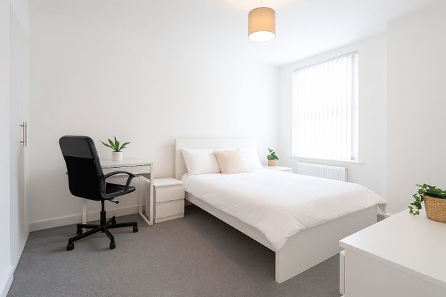 A Bright And Modern Double Bedroom Featuring A Com...