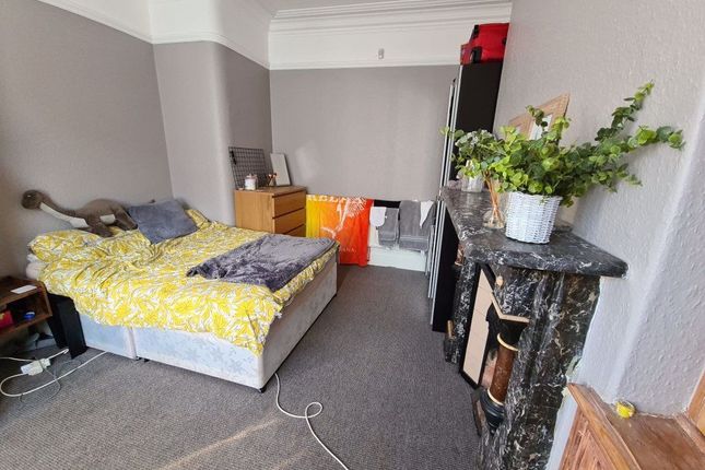 A Cozy Double Bedroom Featuring A Comfortable Bed ...