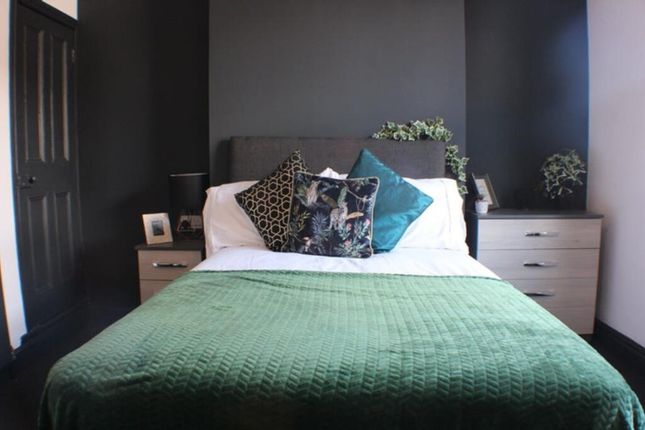 This Inviting Double Bedroom Features A Cozy Atmos...