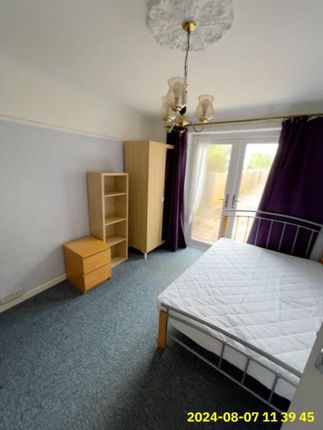 A Bright And Tidy Single Bedroom Featuring A Large...