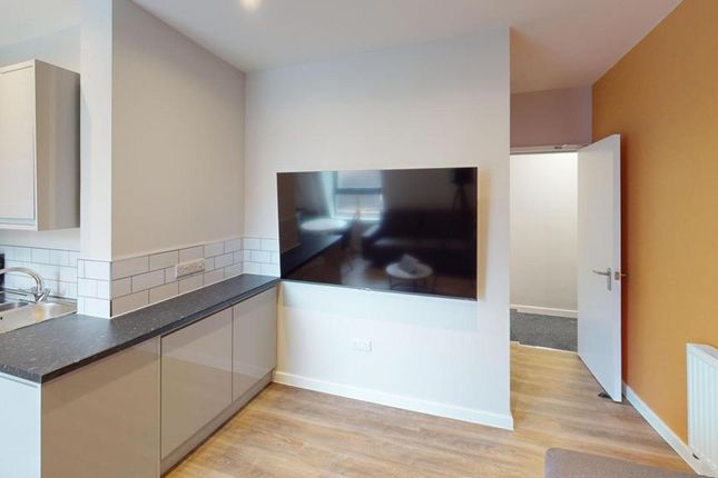 A Modern Kitchenette That Is Clean And Well-Lit, P...