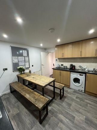 Bright, Modern Communal Kitchen With Wooden Cabine...